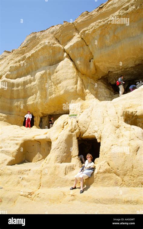 Visitors At The Limestone Caves Near Matala On The Greek Island Of