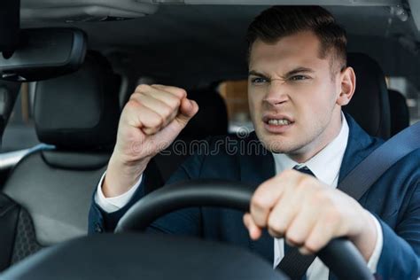 Angry Businessman Showing Fist While Driving Stock Image Image Of