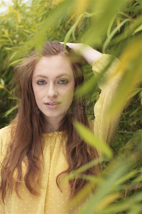 Attractive Red Haired Woman Relaxing In Garden Stock Image Image Of