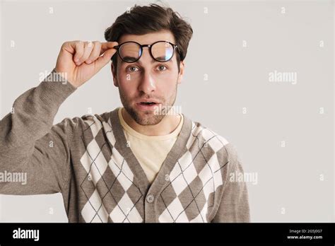 Brooding Handsome Guy In Eyeglasses Looking At Camera Isolated Over