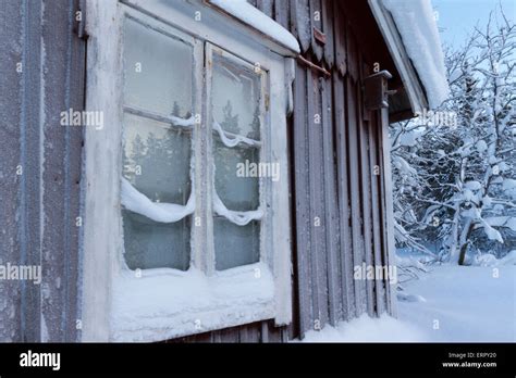 Reflection In Frosty Window On Old House In Winter And Cold Temperature