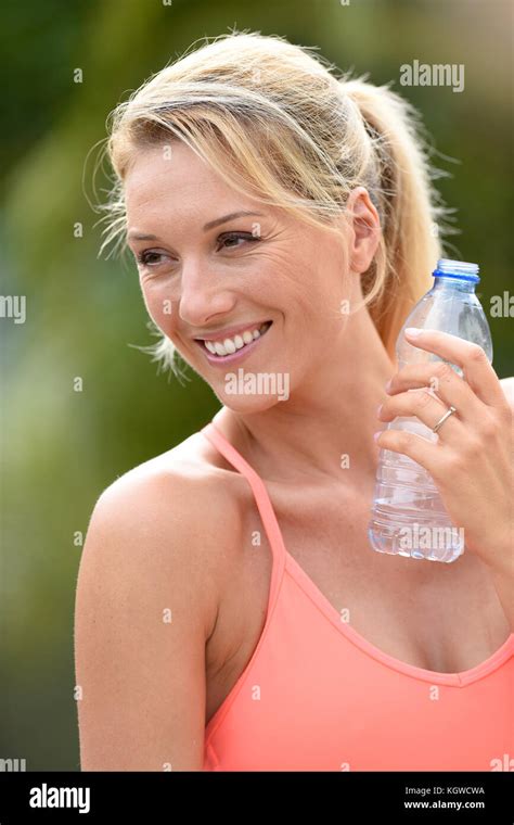 Fitness Girl Drinking Water After Exercising Stock Photo Alamy