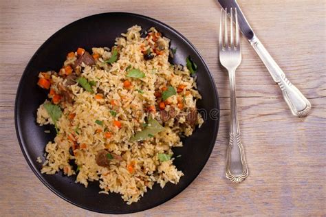 Pilaf With Beef Carrots Onions Garlic And Spices Plov Stock Photo
