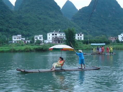 Bamboo Rafting On The Yulong River Near Yangshuo Guangxi Province