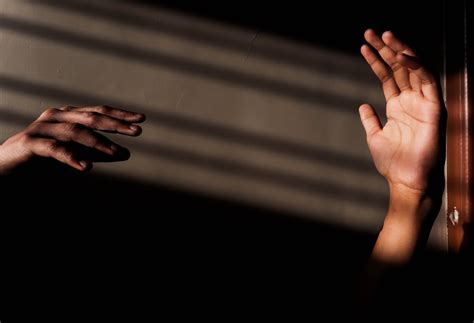 Persons Hand On Black Surface · Free Stock Photo