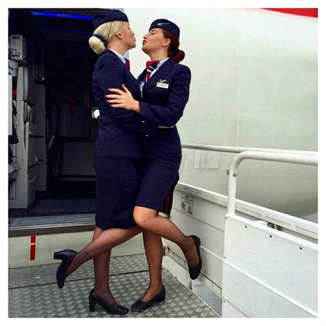 Two Ba Stewardesses Congratulate Each Other After Having Prevented A Crazed Passenger Trying To