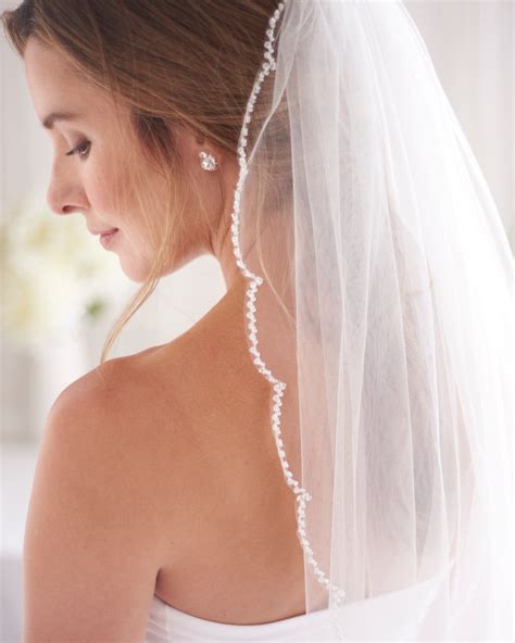 our keily scalloped edge beaded veil perfectly frames the face with a delicately designed