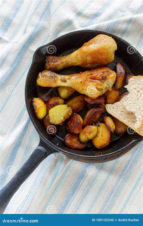 Fried Chicken Legs And Fried Potatoes In Frying Pan Stock Photo Image