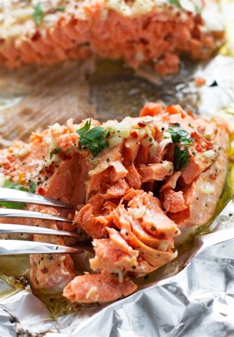 Wrap the fillets or steaks in aluminum foil and bake them for eight to 12 minutes or until their internal temperature reaches at least 145 f, as recommended by the usda food safety and inspection service. Garlic Butter Baked Salmon in Foil | Recipe | Cooking ...