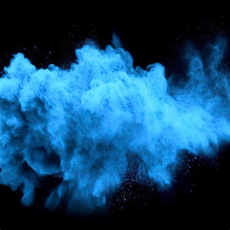 Premium Ai Image Blue Powder Explosion Cloud On Black Background