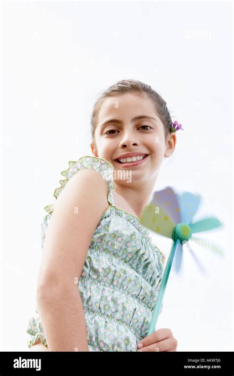 Smiling Pre Teen Girl Holding Pinwheel Low Angle View Stock Photo Alamy
