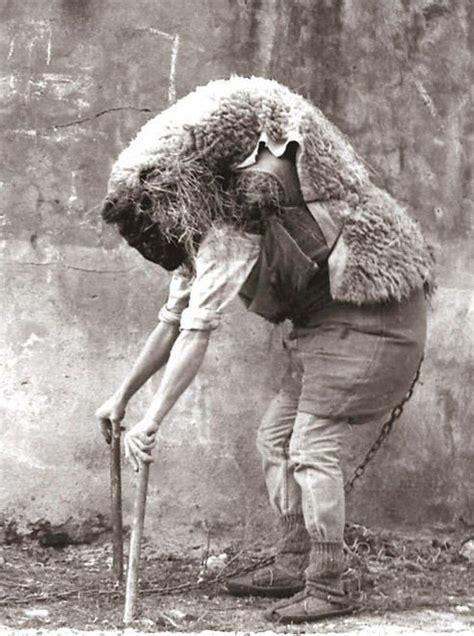 An Old Black And White Photo Of A Man With A Sheeps Head On His Back