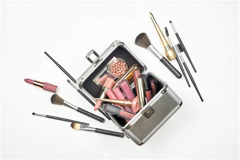 Cosmetic Box With Professional Beauty Tools And Accessories On White Background Creative