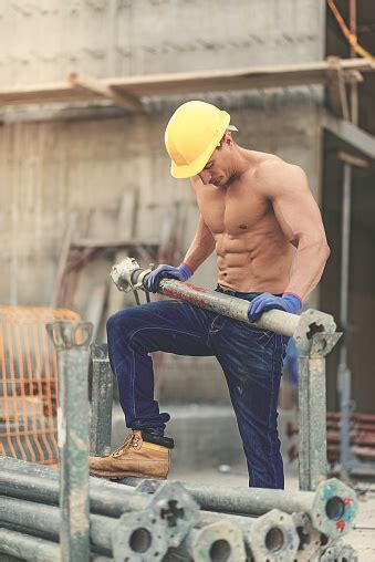 Vintage Image Of Body Builder Resting On Construction Site Stock Photo