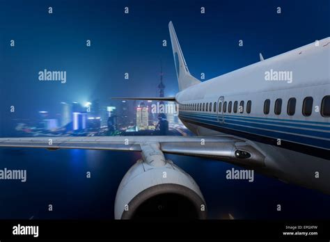 Airplane Fly Above The City Stock Photo Alamy