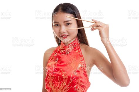 Asian Girl In Chinese Cheongsam Dress With Chopsticks Stock Photo