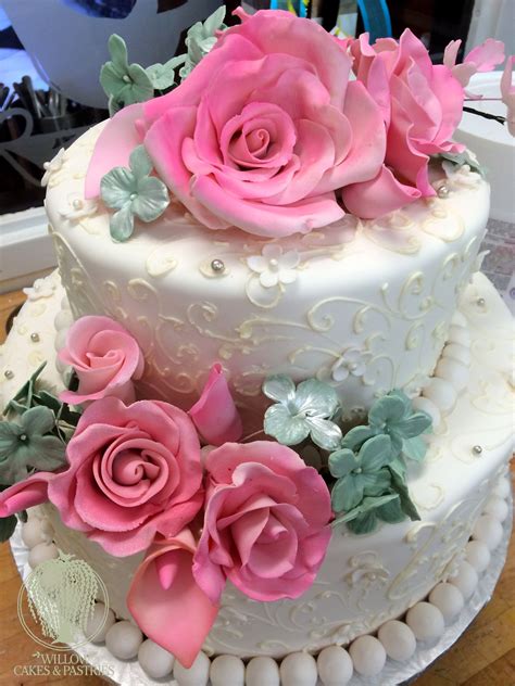 Brilliantly Pink Flowers Adorn This Beautiful Two Tiered Weddingcake