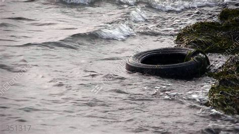 Old Tyre In Dirty Polluted Sea Environment Pollution Stock Video