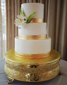 Only the rich could afford white flour and sugar so a white cake was considered a symbol of your wealth. Wedding Cakes Pictures: Gold Wedding Cakes