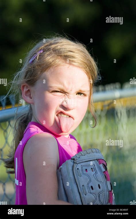 Girl Sticking Making Funny Face Stock Photo Alamy