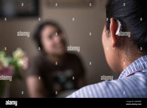 Close Up Of Woman With Hearing Aid Stock Photo Alamy