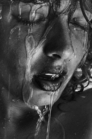 Black And White Photograph Of A Womans Face With Water Dripping From