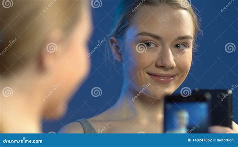 beautiful teen girl making selfie photos on smartphone in front of mirror stock footage video
