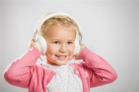 Cute Little Girl Listening Music On Headphones Stock Photo Image Of