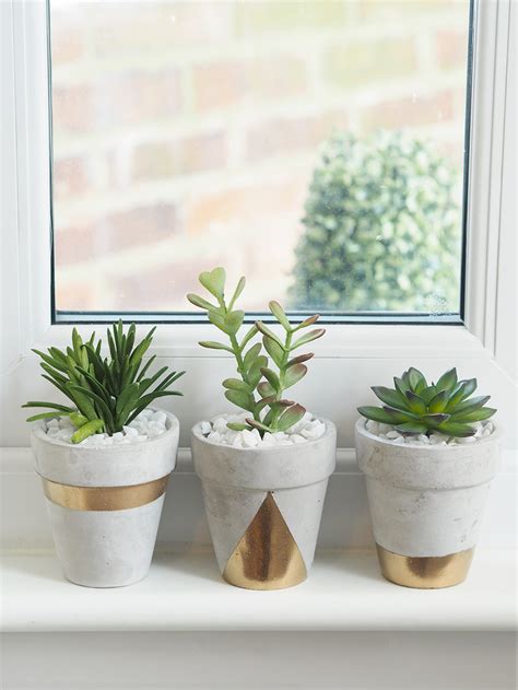 You don't need to paint it inside, plus it's better if the pot itself is a little porous. Gold Concrete Succulent Planters DIY - Bang on Style
