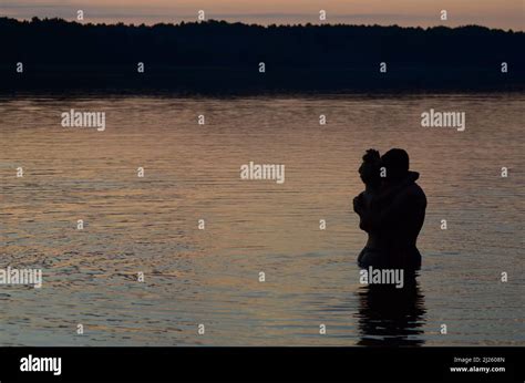 Couple In Love Having Romantic Tender Moments At Sunset Honeymoon Lovers Hugging On Beach