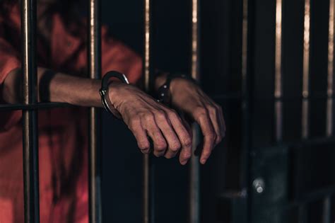 Prison Bars Hands