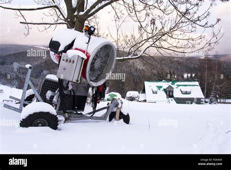 Snow Making Machine On Piste At Ski Resort In Snowy Country Stock Photo
