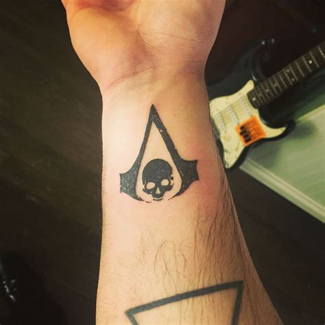 Assassin S Creed Tattoo Assassins Creed Tattoo Tattoos Triangle Tattoo