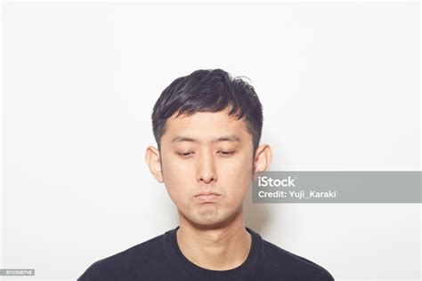 Blank Expression Young Man Looking Down Stock Photo Download Image
