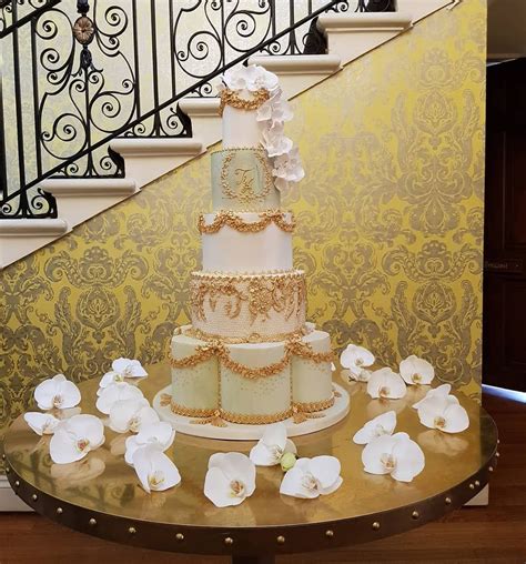 Whether you're eyeing a classic cake decorated with fresh flowers or a more modern design, a professional wedding cake baker in reno can create a confection to suit your style. Luxurious five-tiered wedding cake in soft sage green and ivory with gold detailing, monogram ...