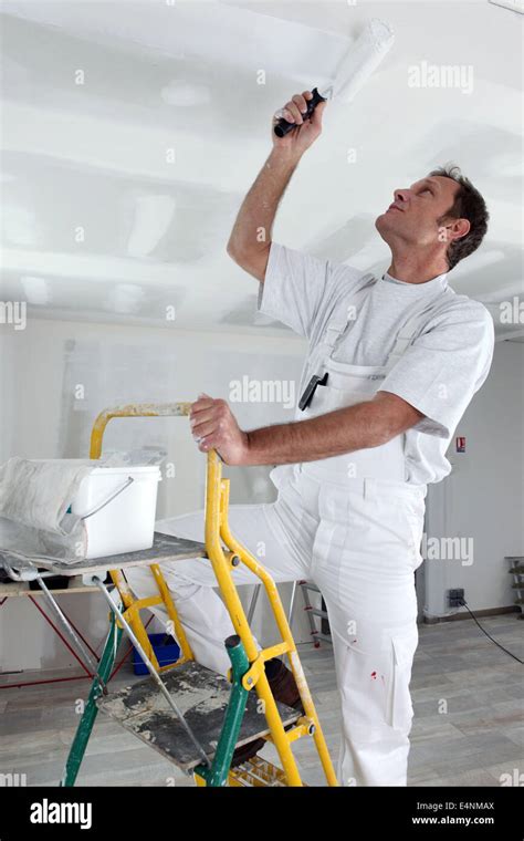 Craftsman Painting The Ceiling Stock Photo Alamy