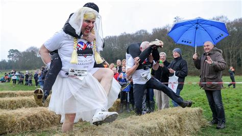 Uk Wife Carrying Contest Takes Place In Dorking Bbc News