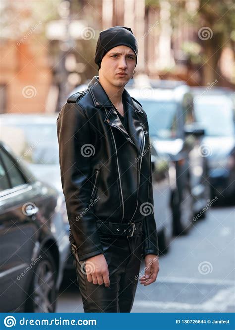 Hipster Man Wearing Black Style Leather Outfit With Hat Pants Jacket And Shoes Standing On