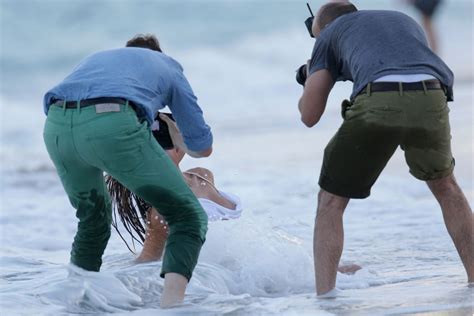 Nina Agdal Has A Couple Wardrobe Malfunctions While Navigating The Surf For A Photoshoot