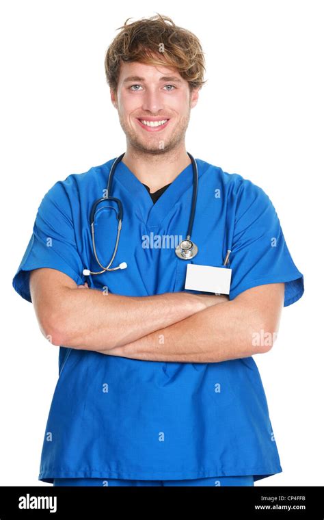 Portrait Of Happy Confident Male Nurse With Arms Crossed In Scrubs
