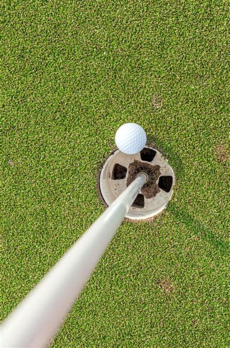 Aerial View Of Golf Ball Near Pin And Hole On Green Grass Of Golf