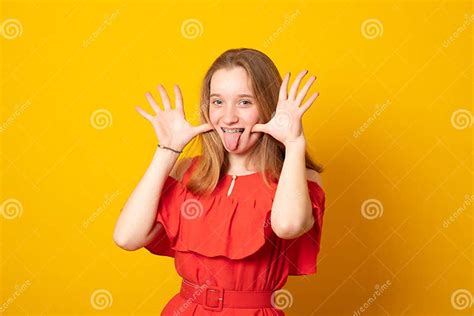 funny teenage girl with braces on her teeth shows her tongue and has fun stock image image of