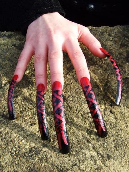 extremely long fingernails very long nails long fingernails curved nails long red nails
