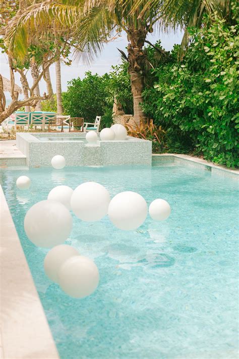 Ideal for connecting foil balloons that only touch in small areas. 36" round white balloons, LED light, fishing line and ...