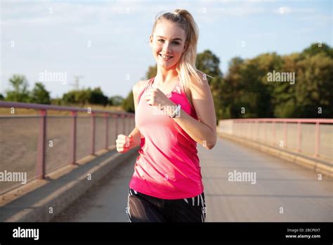 Attractive Young Woman Jogging Outdoors Stock Photo Alamy