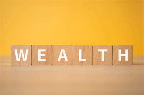 Premium Photo Wooden Blocks With Wealth Text Of Concept