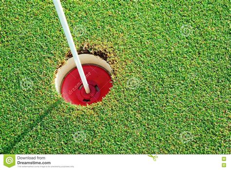 Golf Practice Putting Green Hole And Marked With A Red Sign Stock Image