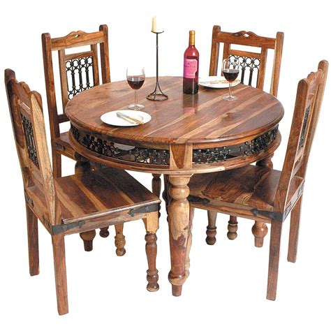 A bench of even a minimalist sofa can be used in the dining space if the space and decor allow it. Round Wooden Indian Dining Table | Wooden Dining Tables