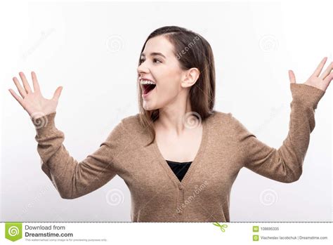 Pleasant Woman Shouting Joyfully And Raising Her Hands Stock Image