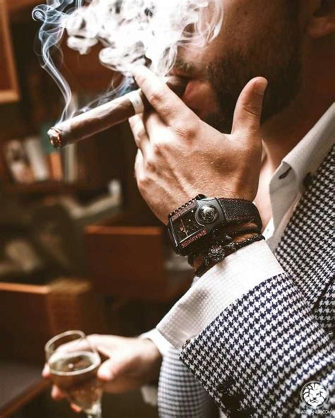 A Special Feature Of The Male Lifestyle Man Smoking Cigars And